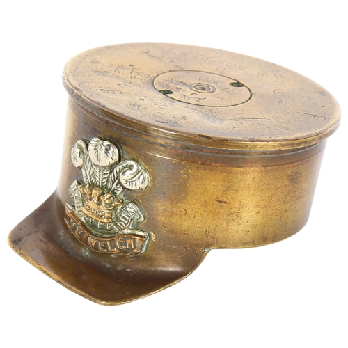 974 - An unusual trench art shell case dated 1915, in the form of a cap with applied 