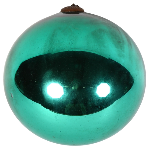 977 - A large green/turquoise lustre witch's ball, diameter 21cm