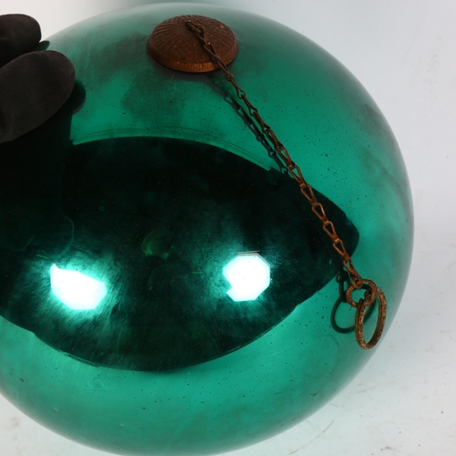 977 - A large green/turquoise lustre witch's ball, diameter 21cm