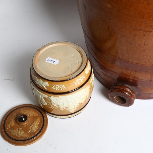 988 - A large stoneware barrel, lacking tap, H41cm, and a Doulton Lambeth stoneware tobacco jar and cover