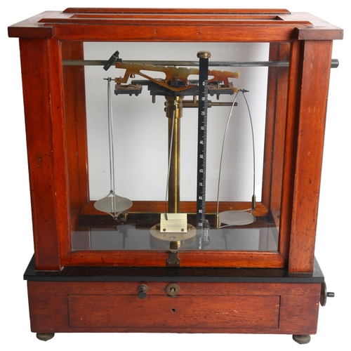 992 - An early 20th century cased set of laboratory scales, H46cm