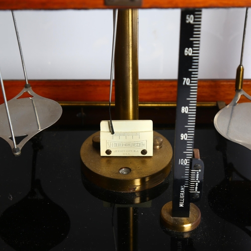 992 - An early 20th century cased set of laboratory scales, H46cm