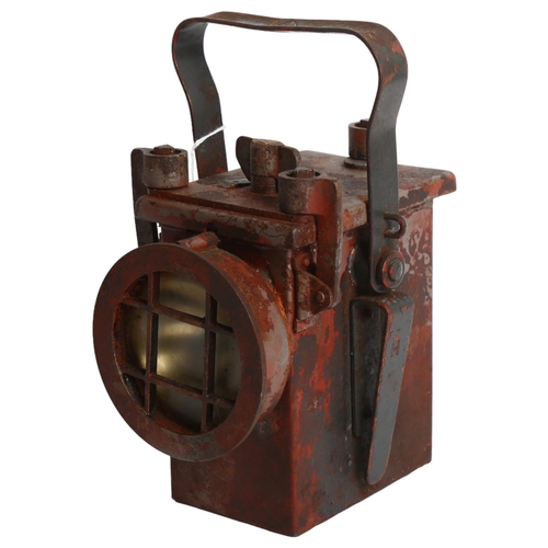 997 - A Second World War Period railway lantern, with partial paint residue, marked with H 1943, and impre... 