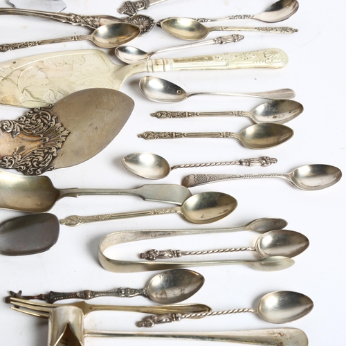 1104 - A tray of mixed spoons, cake slice, tea strainer, pickle forks, and an engraved goblet