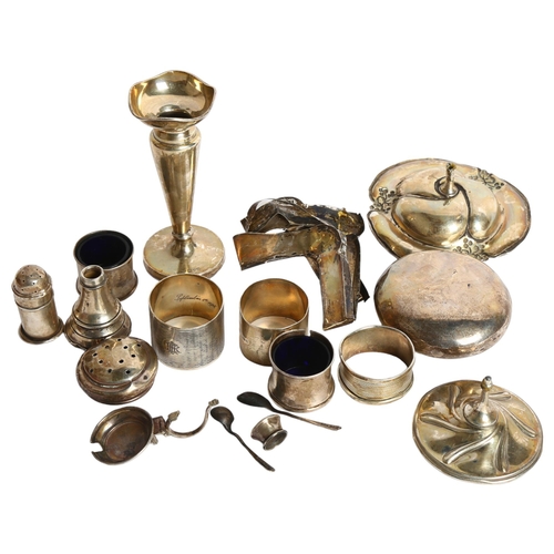 1111 - A quantity of silver items, including a snuffbox, cruet set, napkin rings, spoons etc, weighable val... 