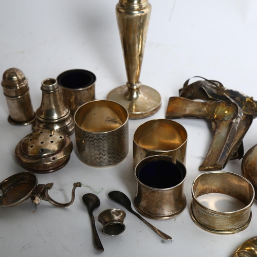 1111 - A quantity of silver items, including a snuffbox, cruet set, napkin rings, spoons etc, weighable val... 