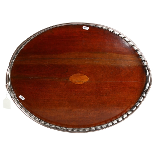 1121 - A large oak serving tray, with silver plate and copper gallery surround, 46cm x 59cm