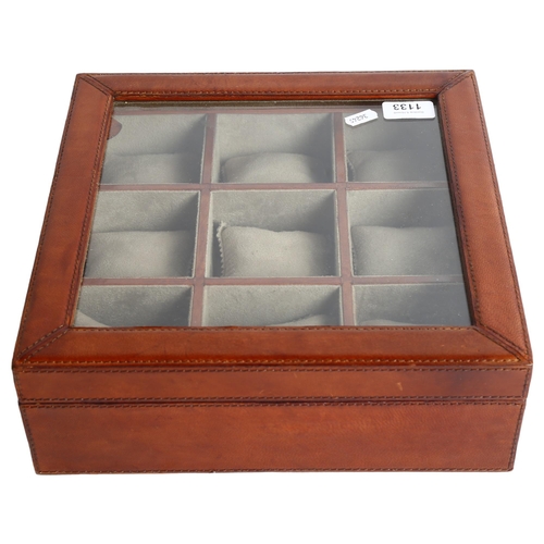 1133 - A leather clear front watch case, with 9 sections