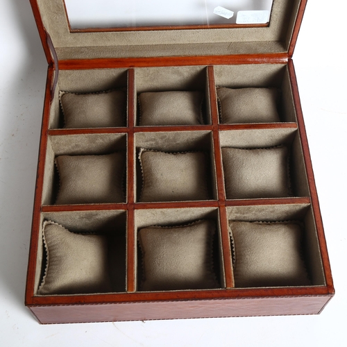 1133 - A leather clear front watch case, with 9 sections