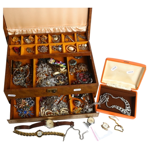 1145 - A brown jewellery box full of costume jewellery, including some silver items, and various watches in... 