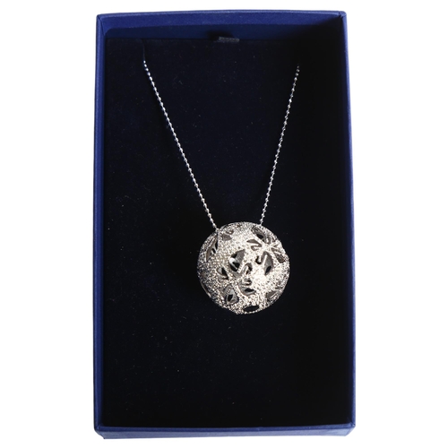 1153 - SWAROVSKI - a crystal set ball pendant and chain, boxed