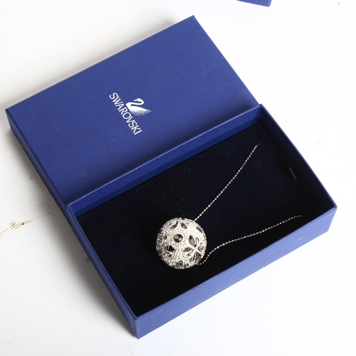 1153 - SWAROVSKI - a crystal set ball pendant and chain, boxed