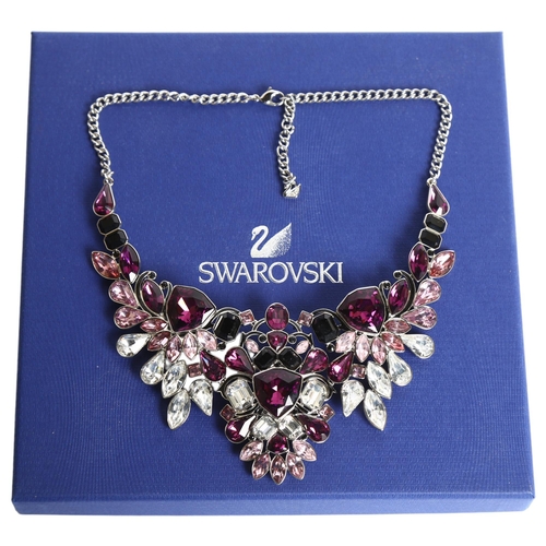 1157 - SWAROVSKI - a palladium plated impulse necklace, set with 3-colour crystals, boxed