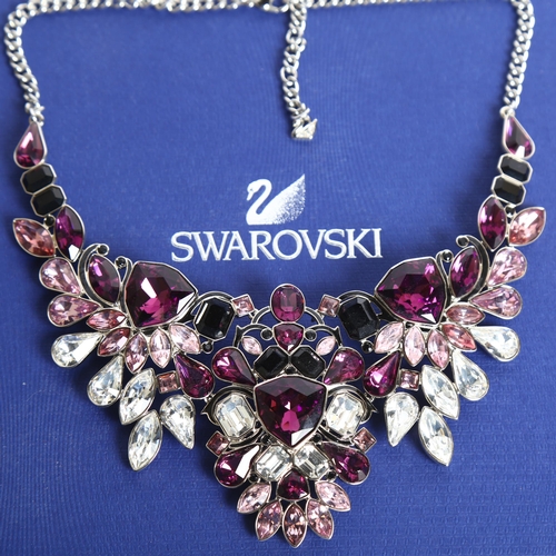 1157 - SWAROVSKI - a palladium plated impulse necklace, set with 3-colour crystals, boxed