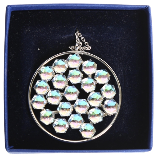 1158 - SWAROVSKI - a palladium plated circular disc pendant and chain, boxed