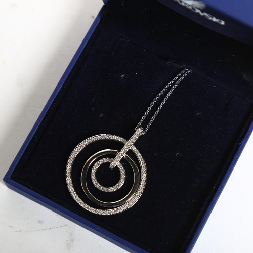 1160 - SWAROVSKI - a circular disc pendant and chain