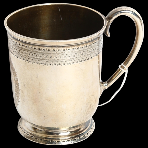 1179 - A Victorian silver christening mug, with engraved decoration and blank cartouche, hallmarks for Lond... 