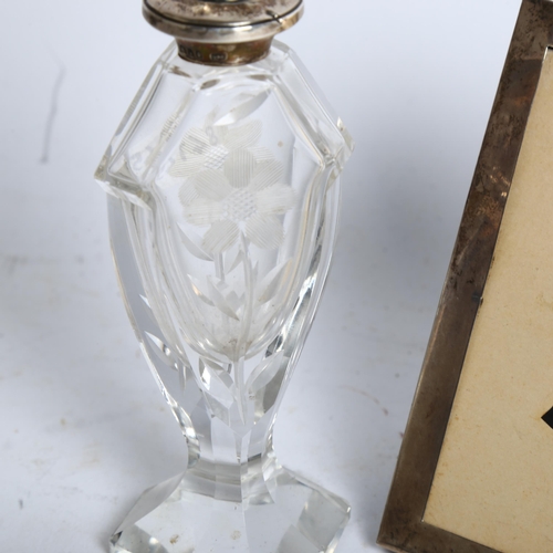 1181 - A rectangular silver-fronted photo frame, and a glass and silver-mount scent bottle