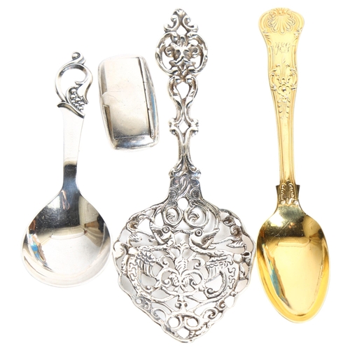 1192 - 2 decorative silver spoons, a silver pillbox, gilded spoon etc