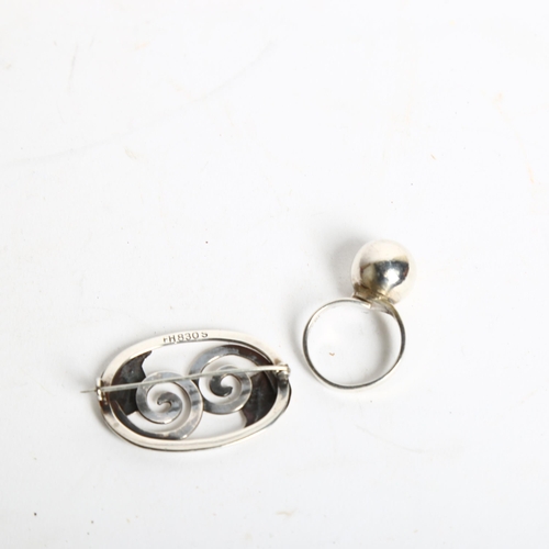 1194 - ISAAC COHEN - a stylised silver ring, and a stylised Danish silver brooch (2)