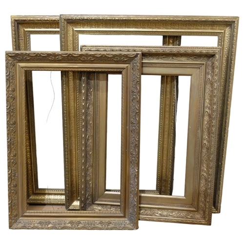 696 - A pair of giltwood and gesso picture frames, 62cm x 75cm, rebate 51cm x 64cm, and 2 others