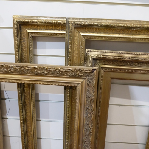 696 - A pair of giltwood and gesso picture frames, 62cm x 75cm, rebate 51cm x 64cm, and 2 others