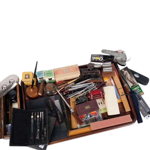 767 - An oak tray with a large quantity of desk items, including fountain pens, hole puncher, rulers, ink ... 