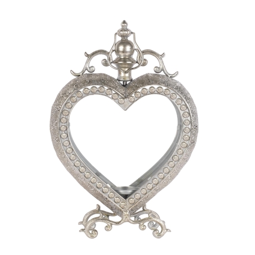 786 - A candle lantern in glazed silvered metal heart-shape frame, H50cm