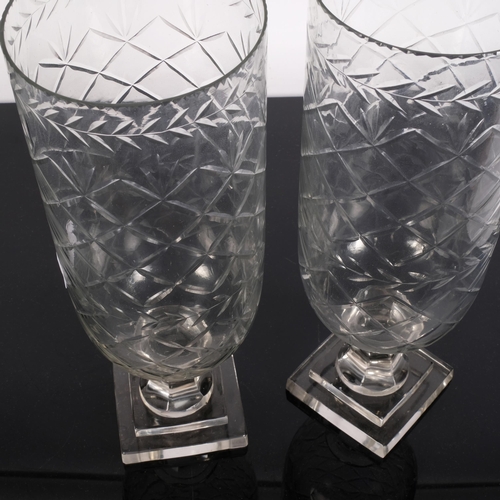 789 - A pair of cut glass hurricane lanterns, on square plinths, H34cm