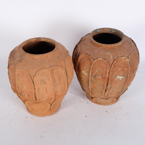 794 - 2 similar terracotta vases, with moulded figure panels, 21.5cm