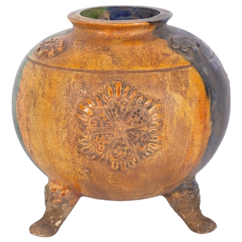 827 - Oriental stoneware pot on 3 feet, with moulded and glazed decoration, H16cm