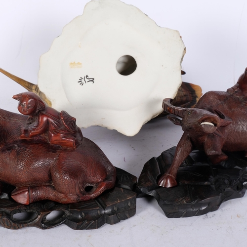 831 - Capodimonte porcelain snipe, and 2 Chinese carved wood water buffalos on stands, L21cm