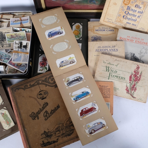 832 - A group of Vintage cigarette cards, various albums and loose cards, and a small framed still life wa... 