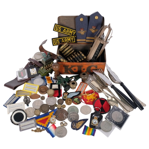 833 - A basket containing various military and other associated items, etc