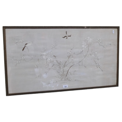 869 - A Chinese silk embroidery, a blossom tree and cranes, 50cm x 90cm overall, framed