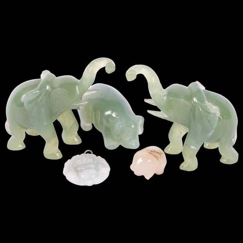 878 - A pair of carved jade elephants, 2 pigs, largest length 7cm, and a Buddha pendant