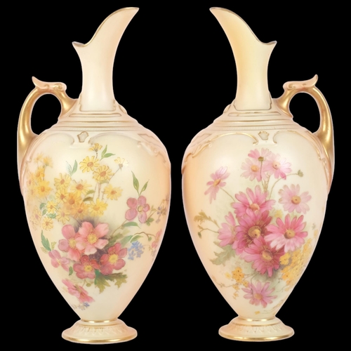 886 - A pair of Royal Worcester Blush Ivory ewers, decorated with sprays of flowers, shape no. 1745, decor... 