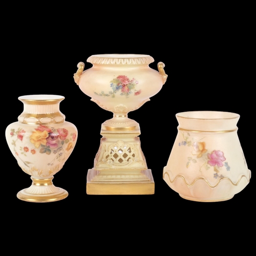 889 - A Royal Worcester Blush Ivory urn-shaped vase, on pierced pedestal base, decorated with sprays of fl... 