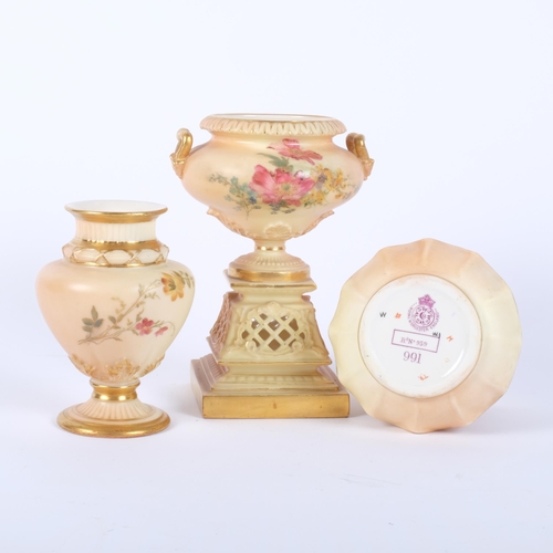 889 - A Royal Worcester Blush Ivory urn-shaped vase, on pierced pedestal base, decorated with sprays of fl... 