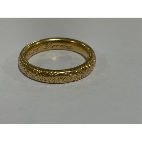 1212 - A heavy early 20th century 18ct gold wedding band ring, maker WJP, London 1913, with engraved foliat... 