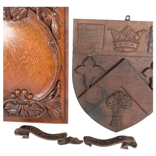 187 - An oak carved coat of arms for Clifton College, L39cm, and an Antique oak panel with applied decorat... 