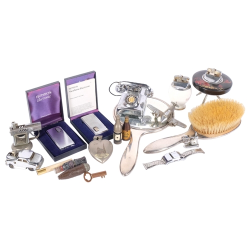 313 - A silver backed dressing table brush and mirror, various vintage lighters,