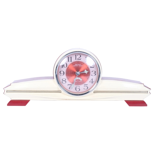 661 - A Seiko Corona Fancy Art Deco style plastic-cased mantel clock, 33cm wide