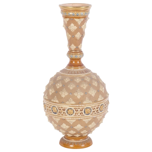 668 - A stoneware vase in Doulton style, with embossed and painted decoration, H33cm