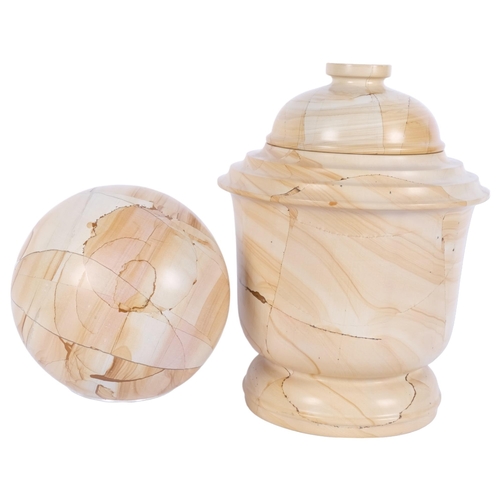 677 - A reconstituted marble jar and cover, H29cm, and a similar ball on plastic stand