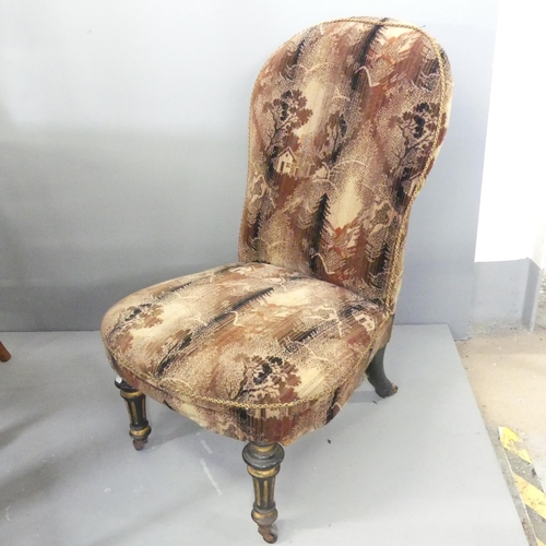 2712 - A Victorian ebonised and upholstered nursing chair.