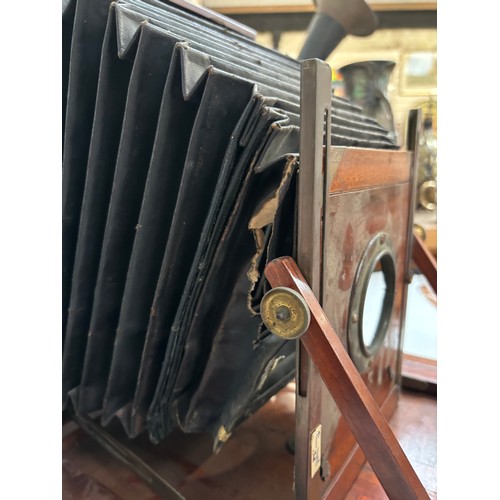 205 - An early 20th century Sands, Hunter & Company Ltd tail board square bellowed plate camera, mahogany ... 