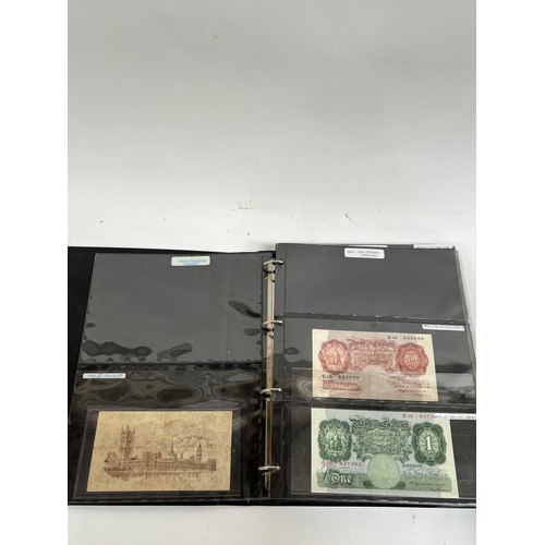 331 - An album of United Kingdom banknotes, including 2 white £5 notes, £1 notes from circa 1930, 1940, 19... 