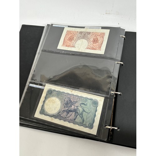 331 - An album of United Kingdom banknotes, including 2 white £5 notes, £1 notes from circa 1930, 1940, 19... 