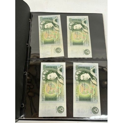 331 - An album of United Kingdom banknotes, including 2 white £5 notes, £1 notes from circa 1930, 1940, 19... 